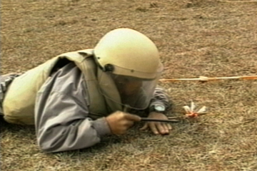 Image of a man in gear for UXO removal